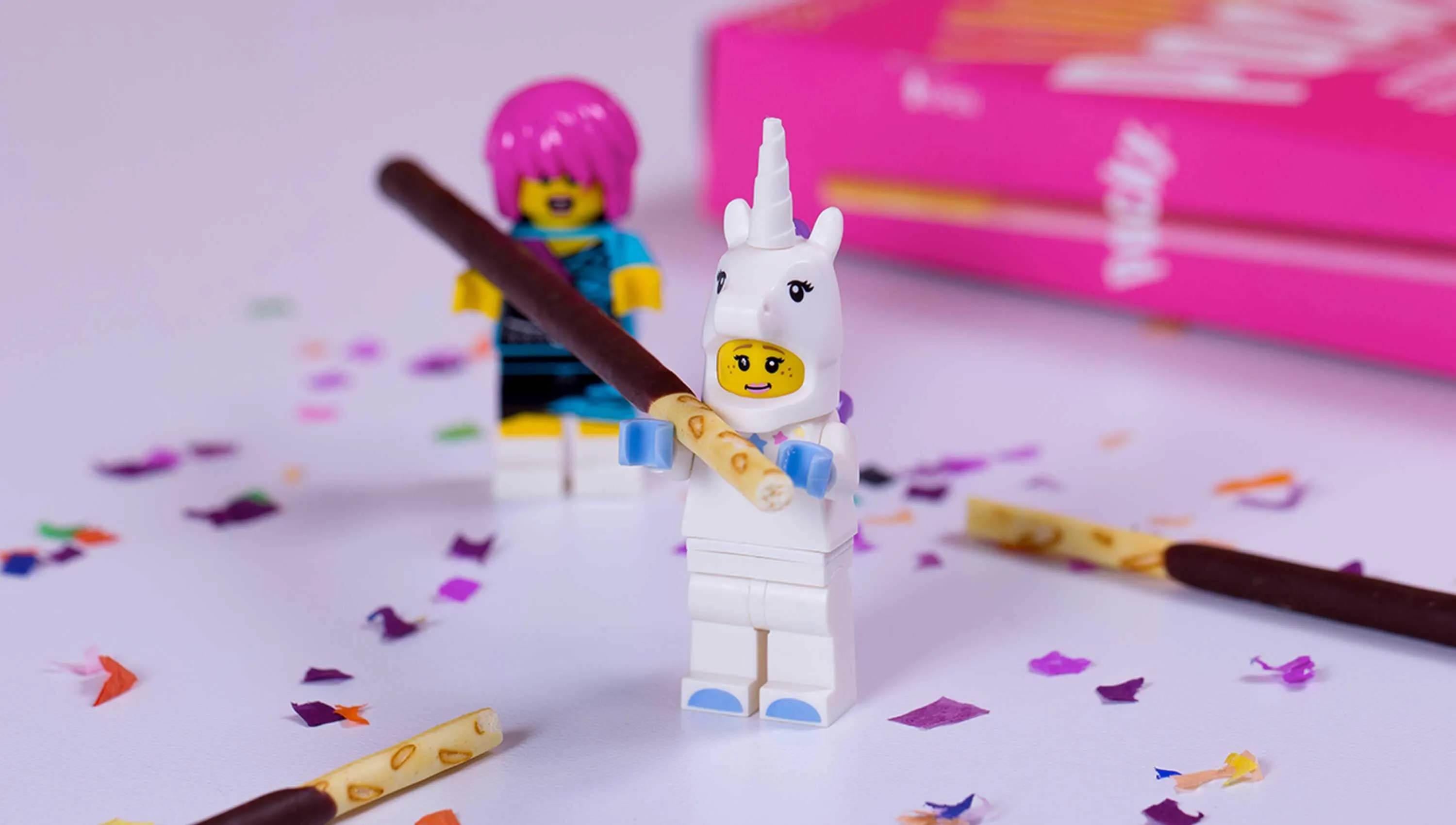 Lego figures playing with Pocky