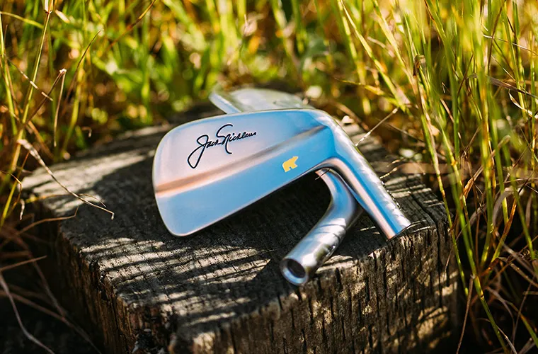 Nicklaus × Miura iron heads on wood