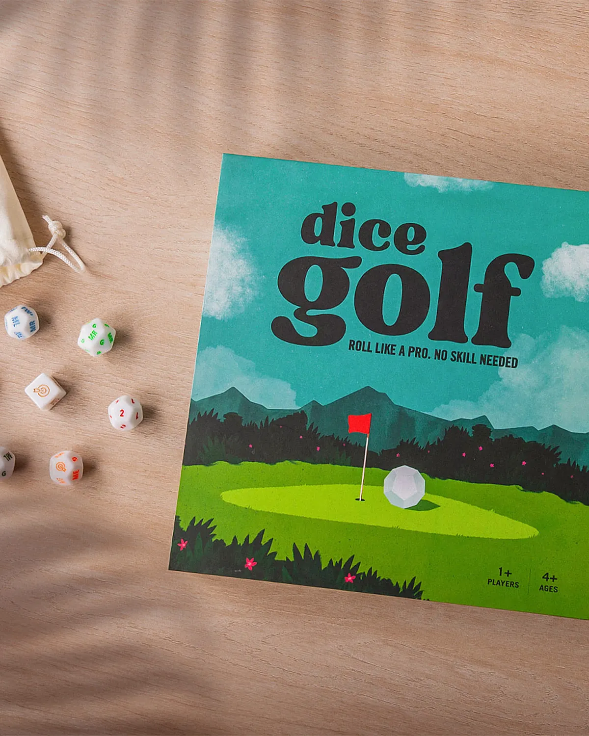 Dice Golf box with dice and a scorecard on a wooden table