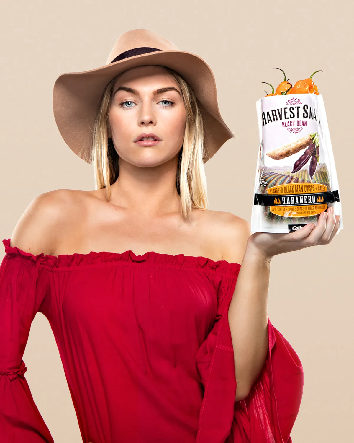 Woman holding a bag of Harvest Snaps